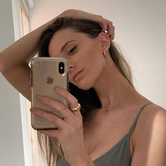 Ana Luisa Jewelry Mirror selfie with rings and earrings